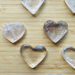 Top-side view of Clear Quartz polished heart, showing subtle veining, for Cleansing and Meditation.