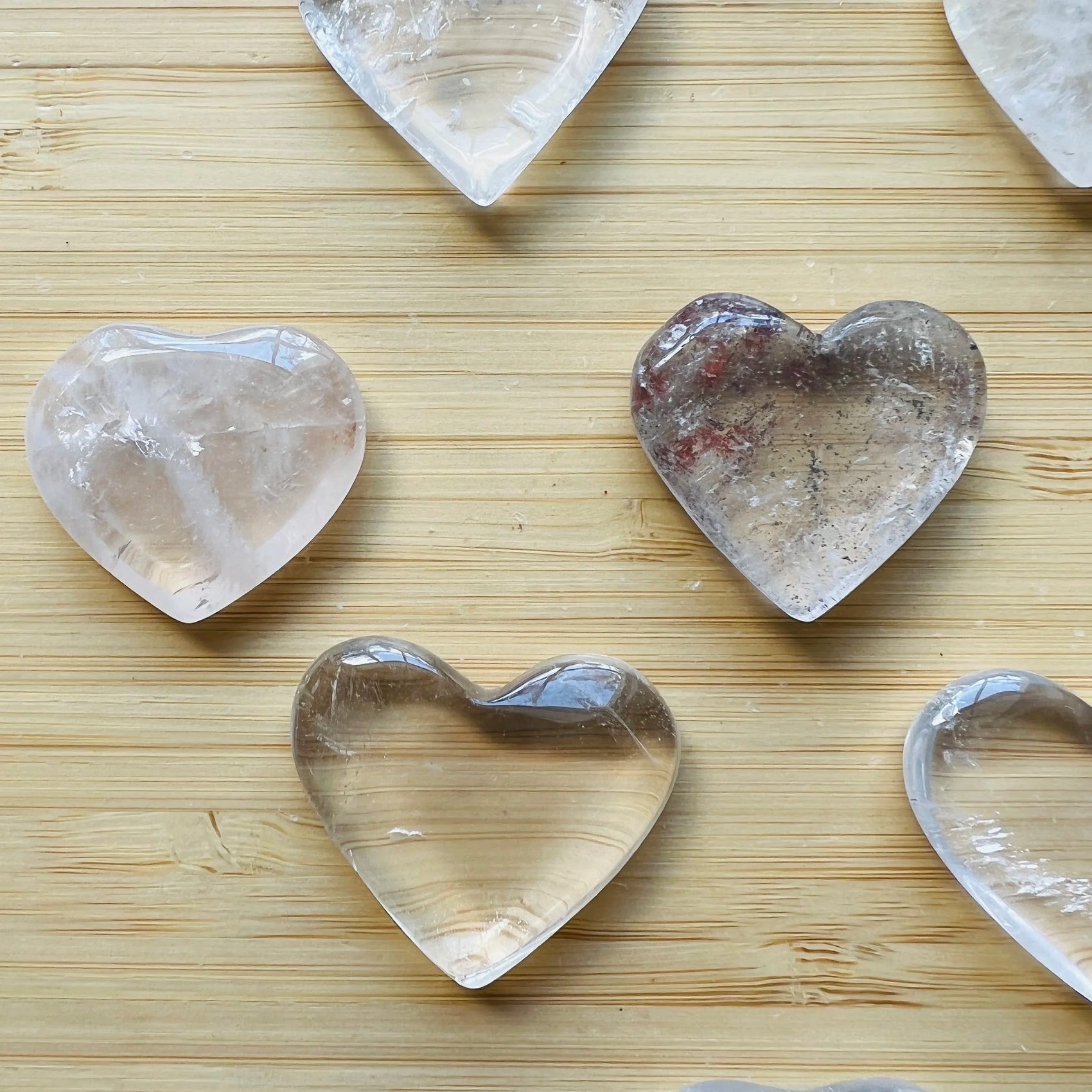 Top-side view of Clear Quartz polished heart, showing subtle veining, for Cleansing and Meditation.
