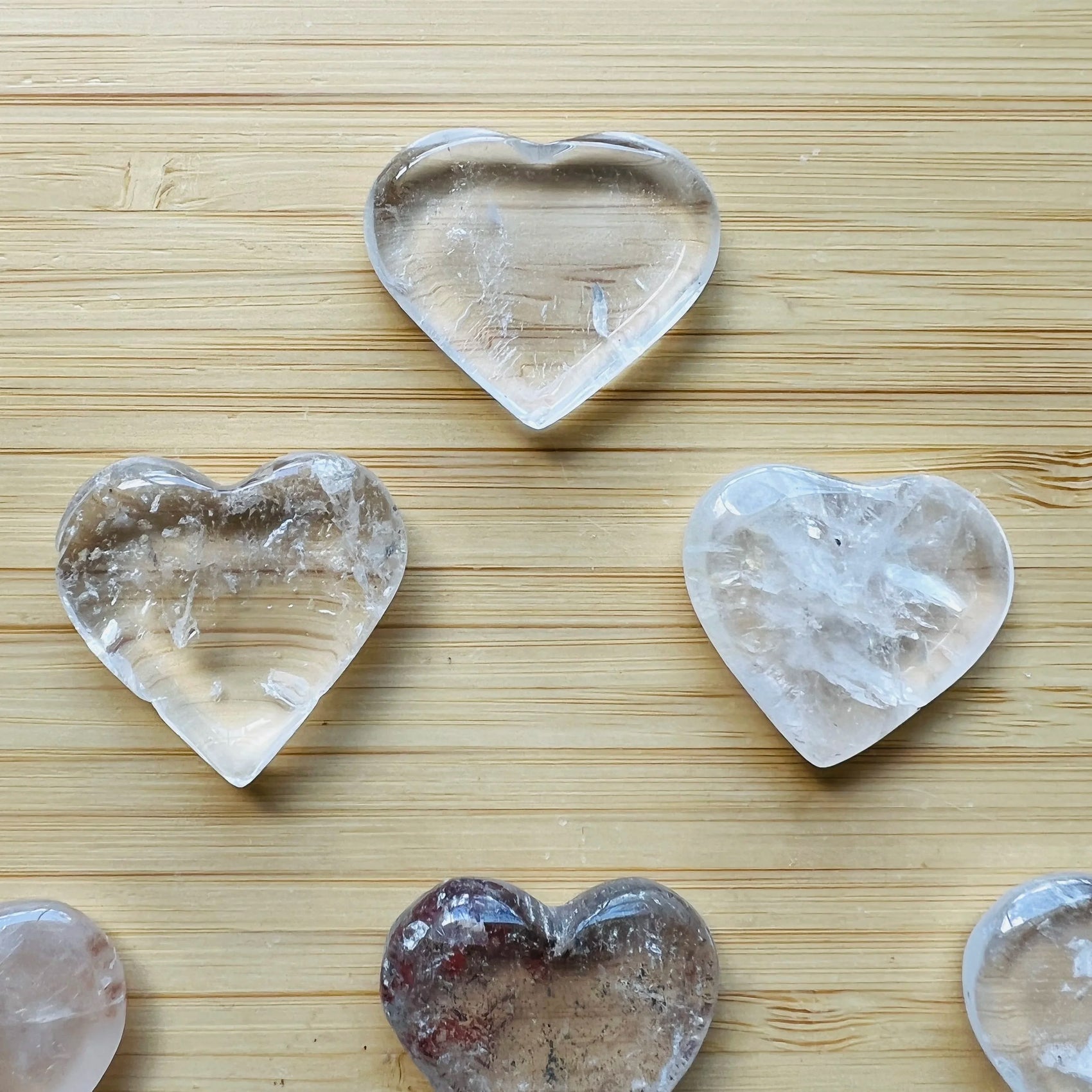 Alternate side of Clear Quartz polished heart, showing natural variation, from Minas Gerais, Brazil.