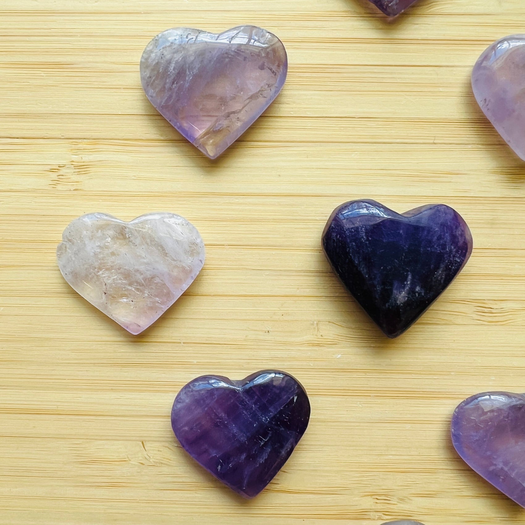 Reverse angle of Amethyst polished heart, hand-selected from Rio Grande do Sul, Brazil, showing characteristic color.