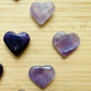 Hand-scale view of Amethyst stone, from Rio Grande do Sul, Brazil, shown for size reference.