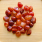 Ethically sourced Grade AA Carnelian tumbled stone from Paraná, Brazil at Beyond Bohemian