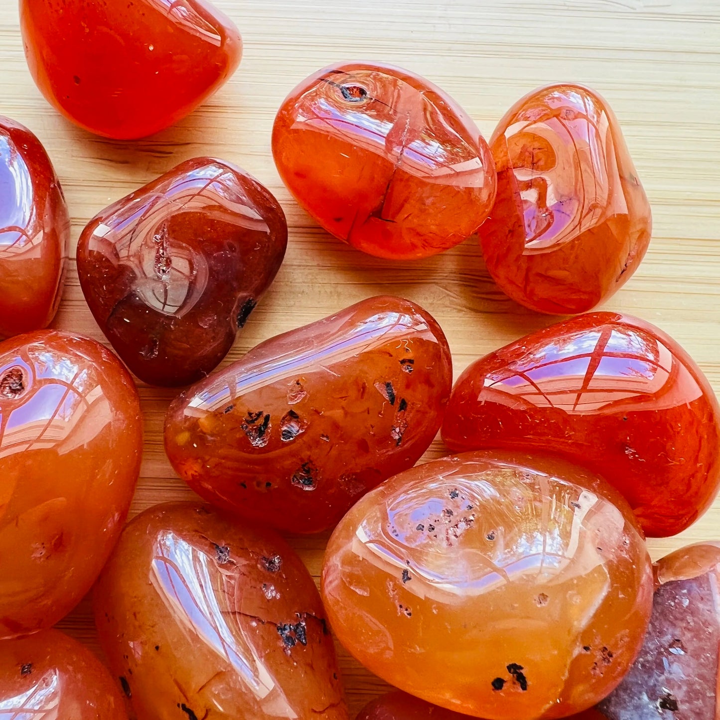 Alternate angle of Grade AA Carnelian tumbled stone showing overall shape