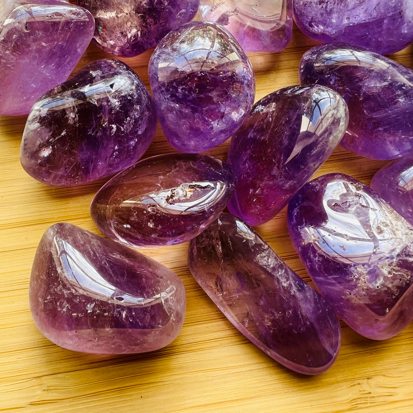 Near view of Amethyst tumbled stone, showing matte finish, to support Stress Relief.