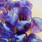 Bottom side of purple Amethyst tumbled stone, from Rio Grande do Sul, Brazil, showing glassy finish.