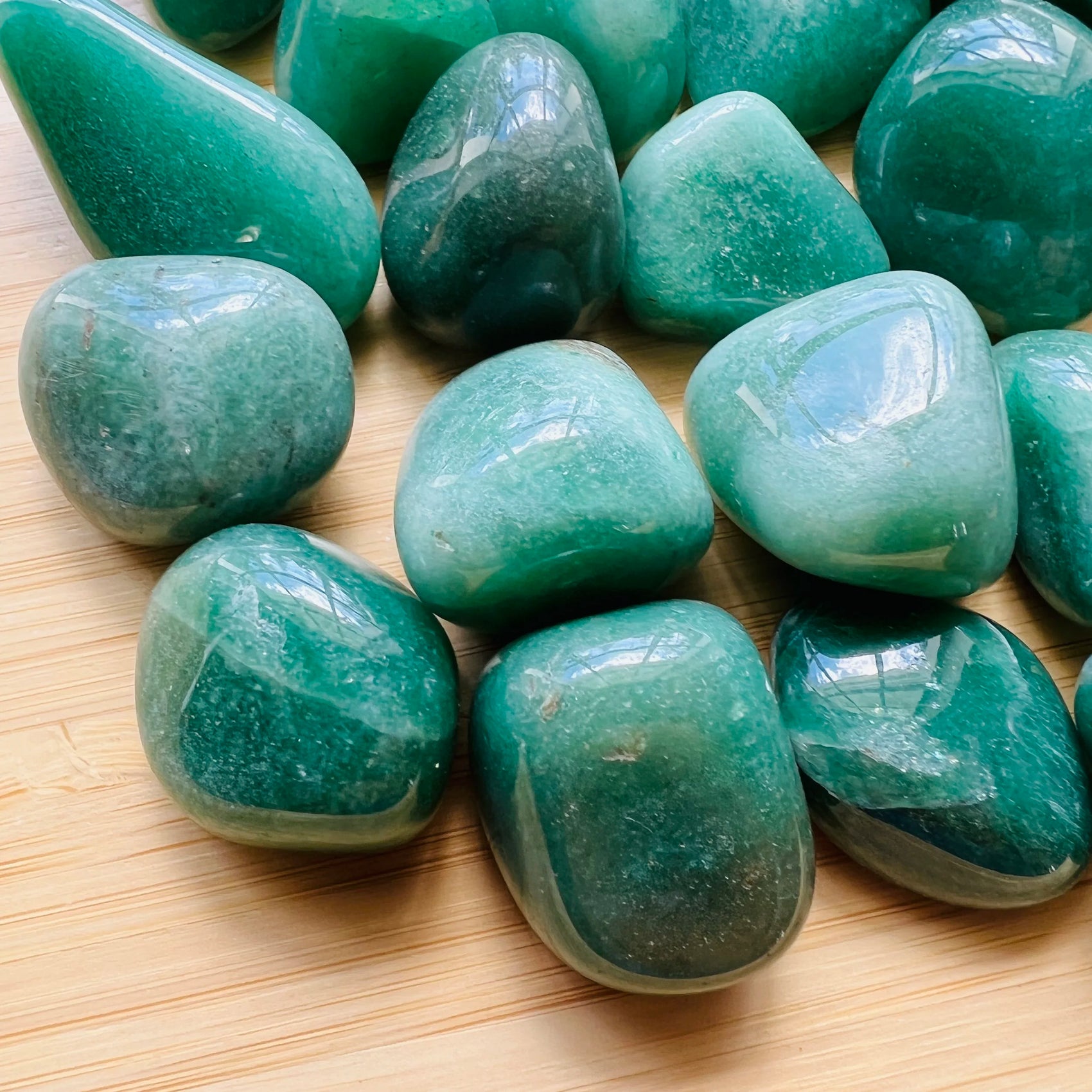 Close-up of Aventurine tumbled stone from Brazil, soothing wellness stone for Abundance
