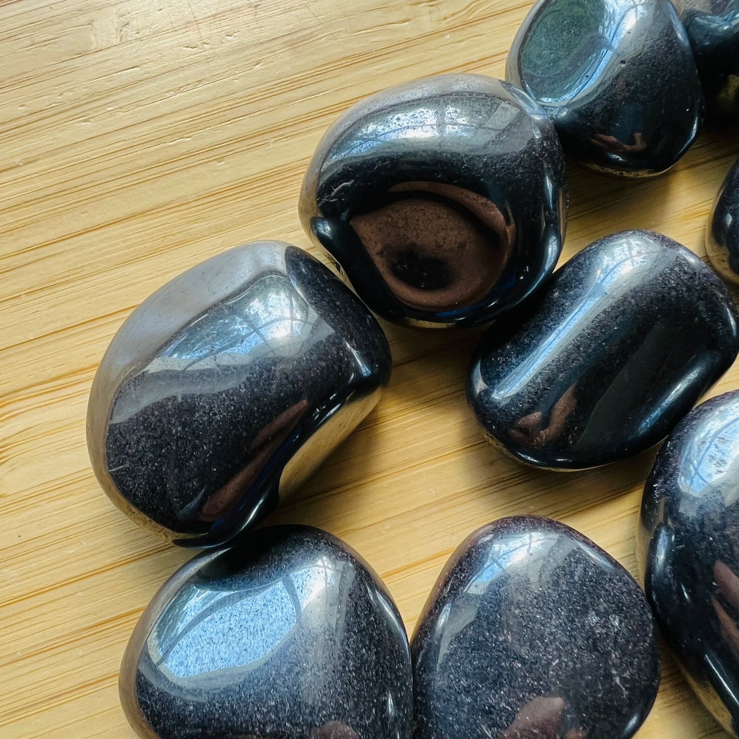 Top view of Hematite tumbled stone, for Grounding, sourced from Brazil.