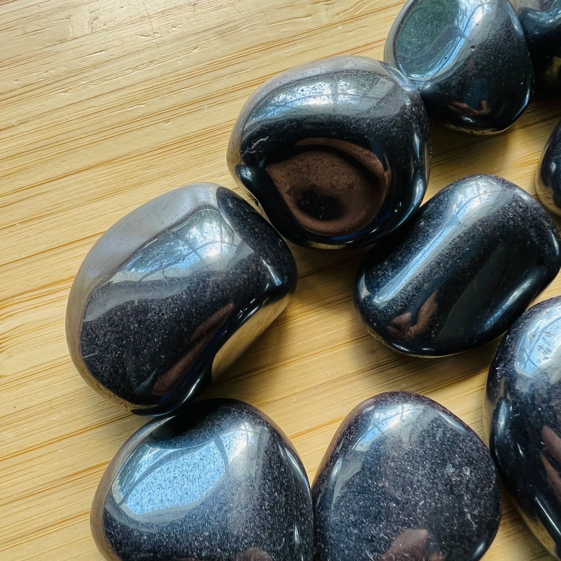 Top view of Hematite tumbled stone, for Grounding, sourced from Brazil.