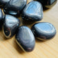 Alternate side of gray Hematite tumbled stone, showing characteristic color.