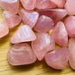 Color detail of pink Rose Quartz tumbled stone, Madagascar-sourced, to support Love.