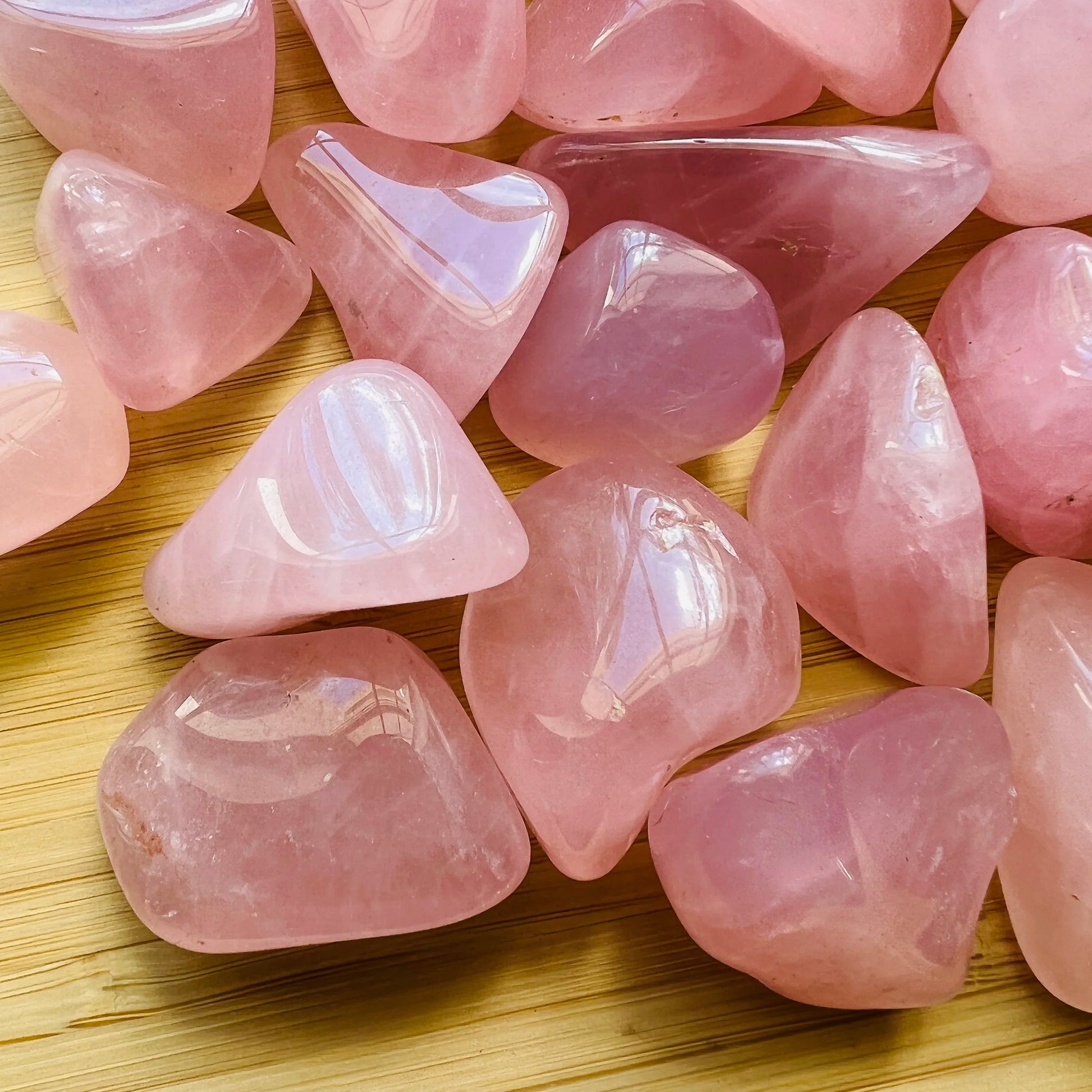 Color detail of pink Rose Quartz tumbled stone, Madagascar-sourced, to support Love.