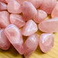 Top-side view of Rose Quartz tumbled stone, showing color depth, traditionally used for Love.