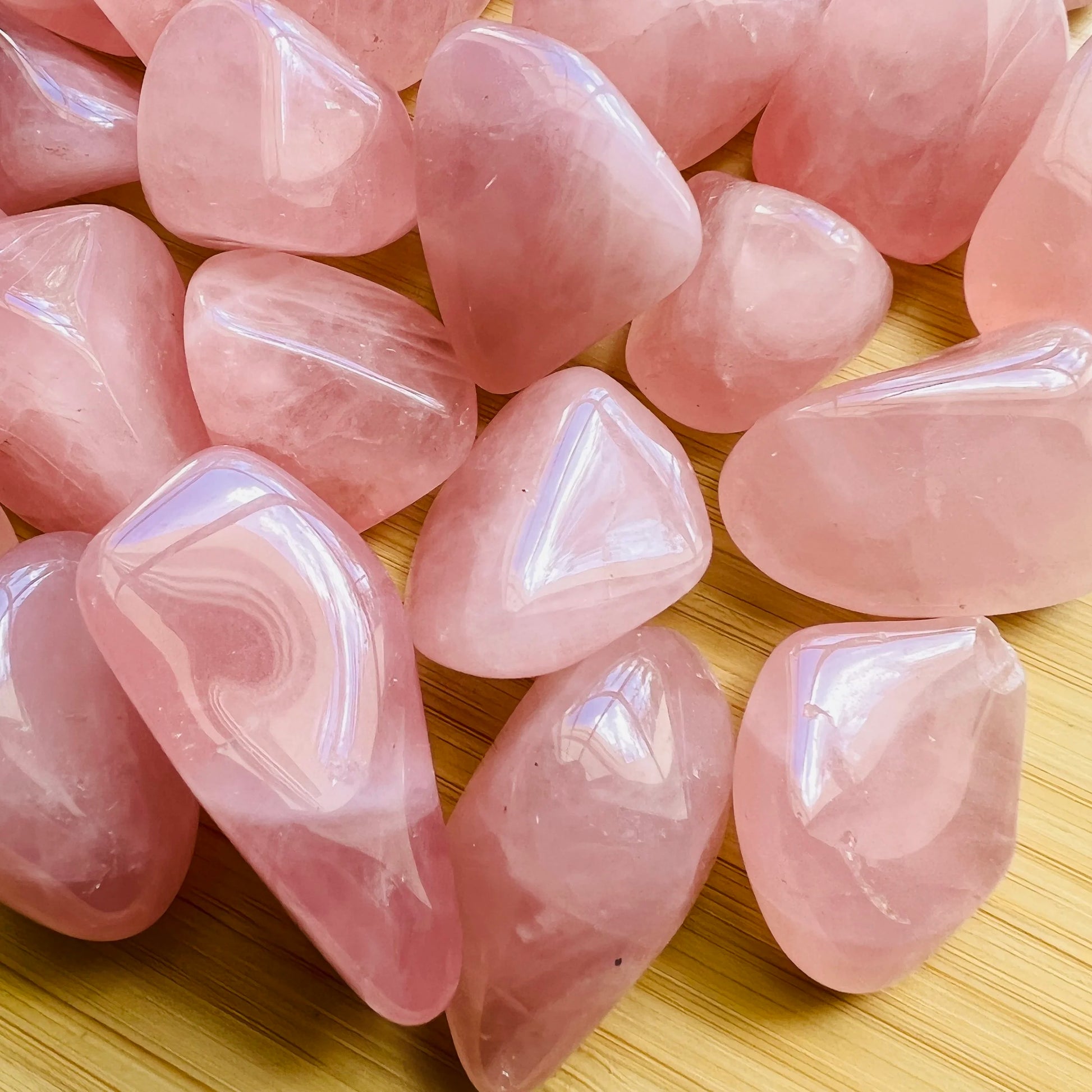 Top-side view of Rose Quartz tumbled stone, showing color depth, traditionally used for Love.