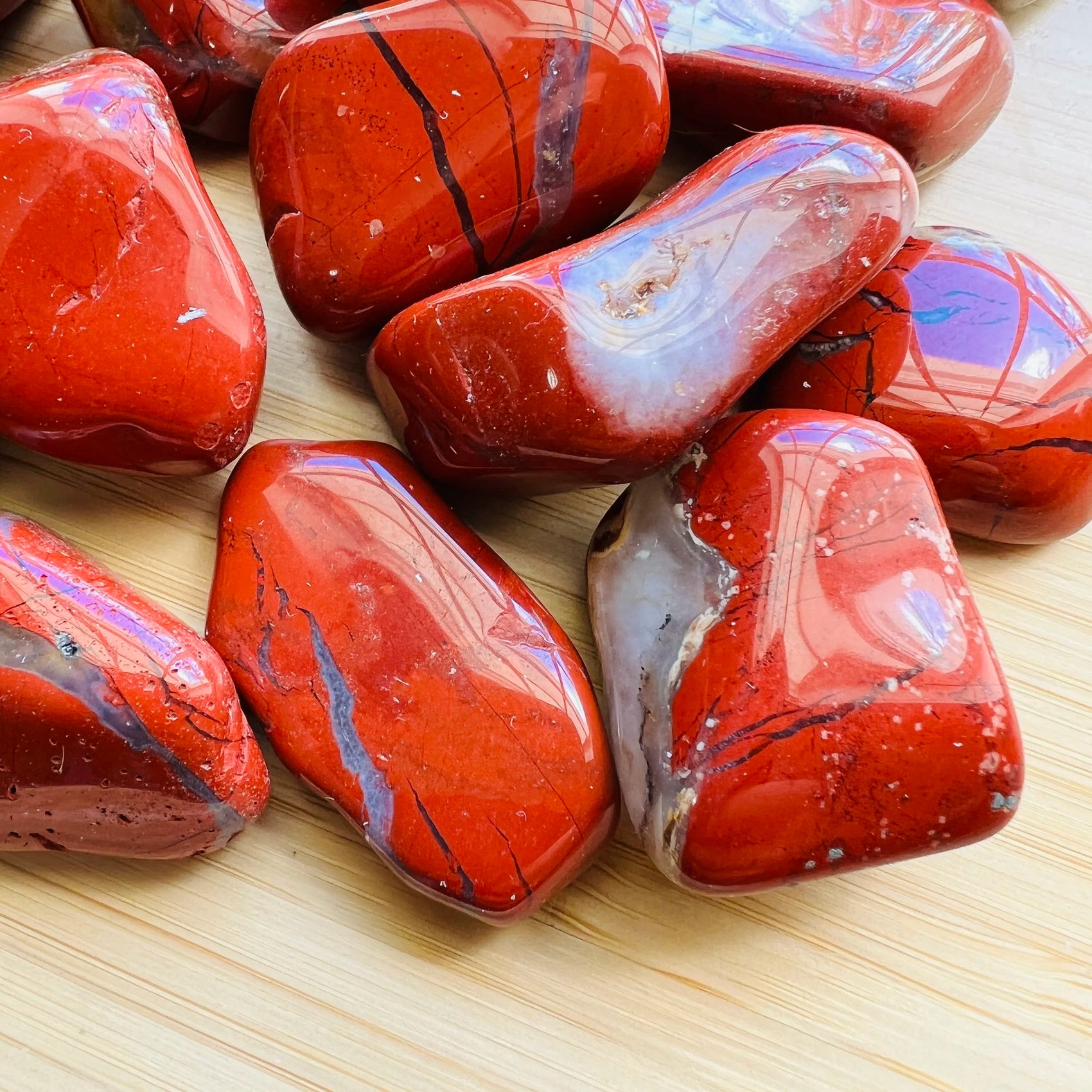 Looking down on Red Jasper tumbled stone, showing natural inclusions.