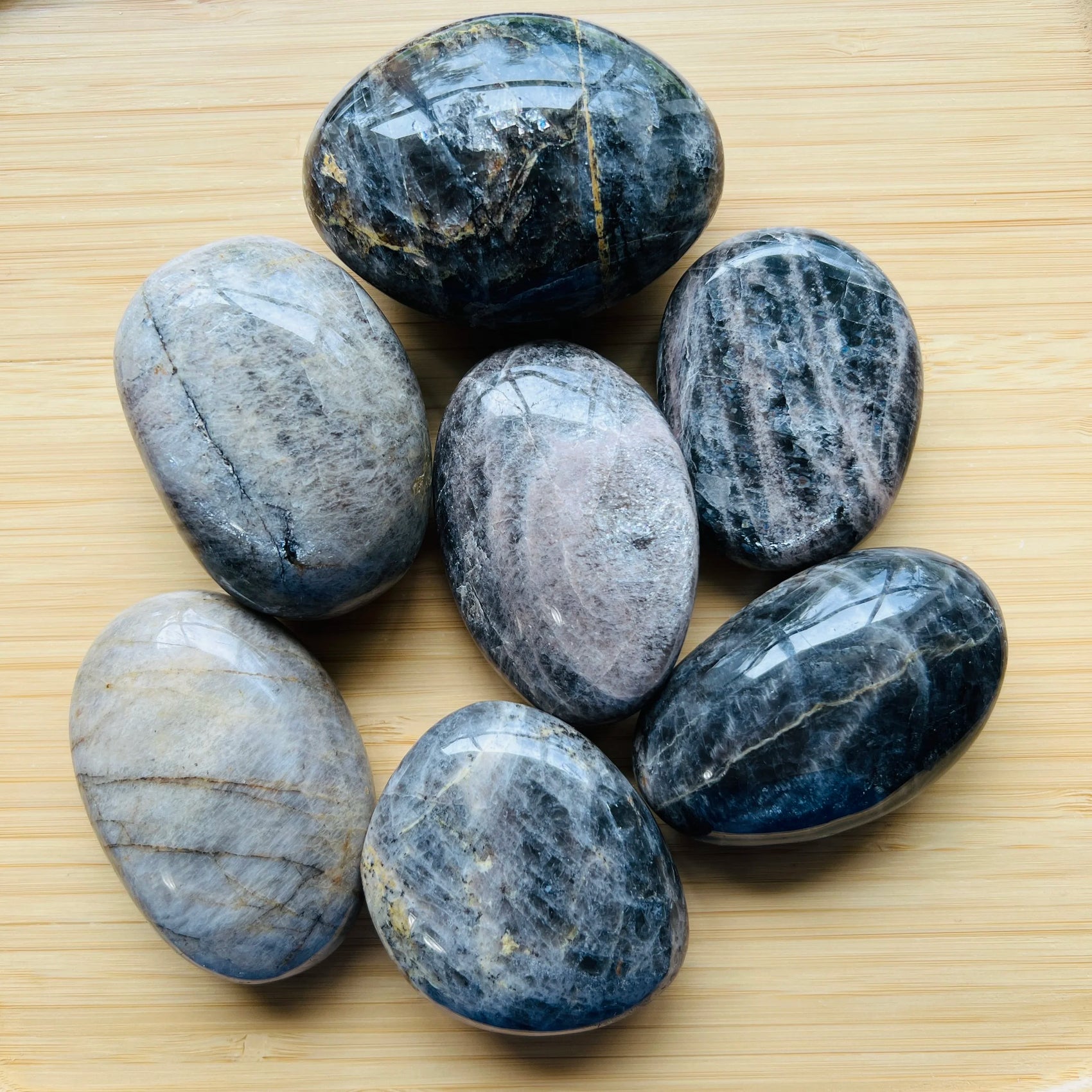 Black Moonstone palm stone in Black, Gray tones, ethically sourced from Madagascar for Intuition and Protection