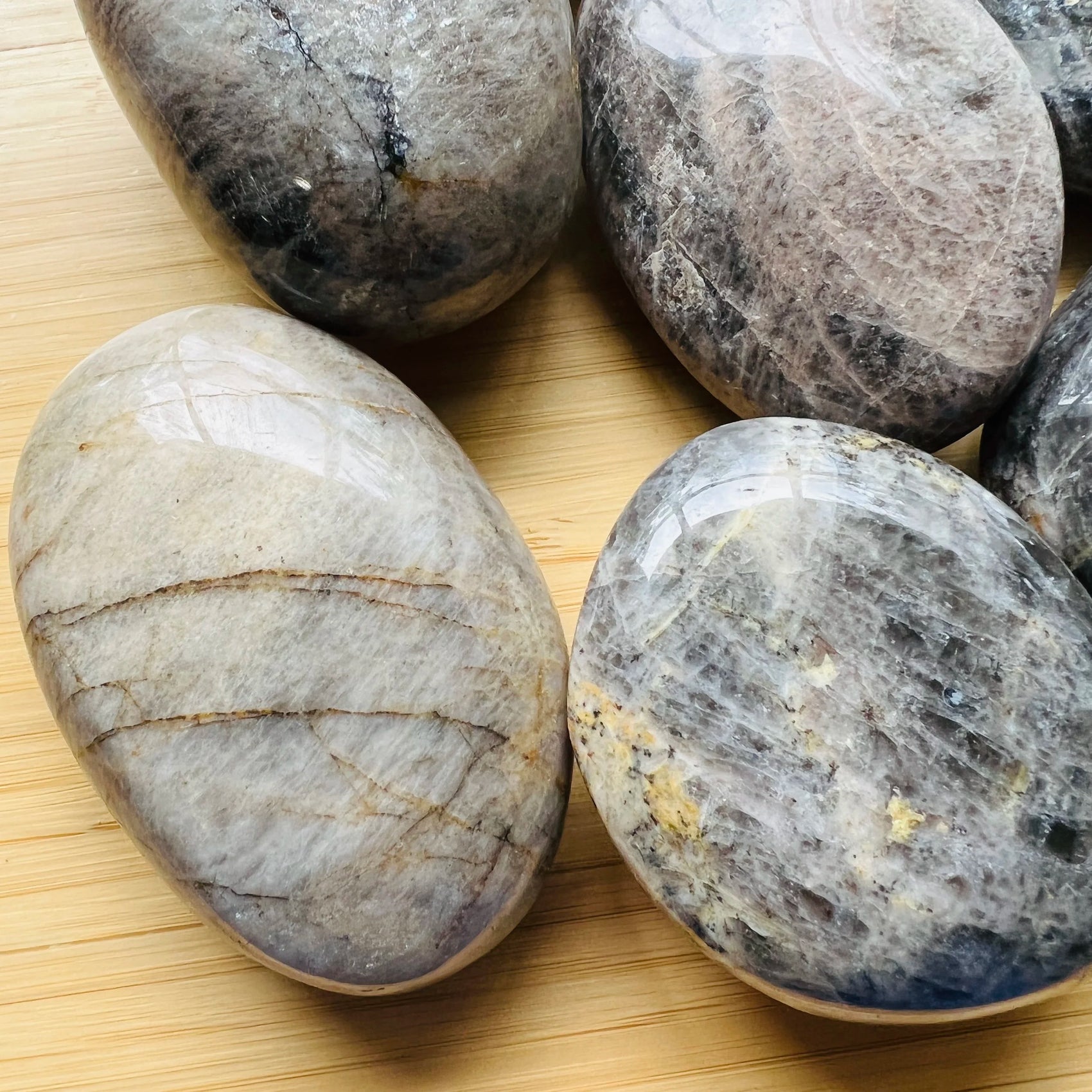 Close-up of Black Moonstone palm stone from Madagascar, soothing wellness stone for Intuition