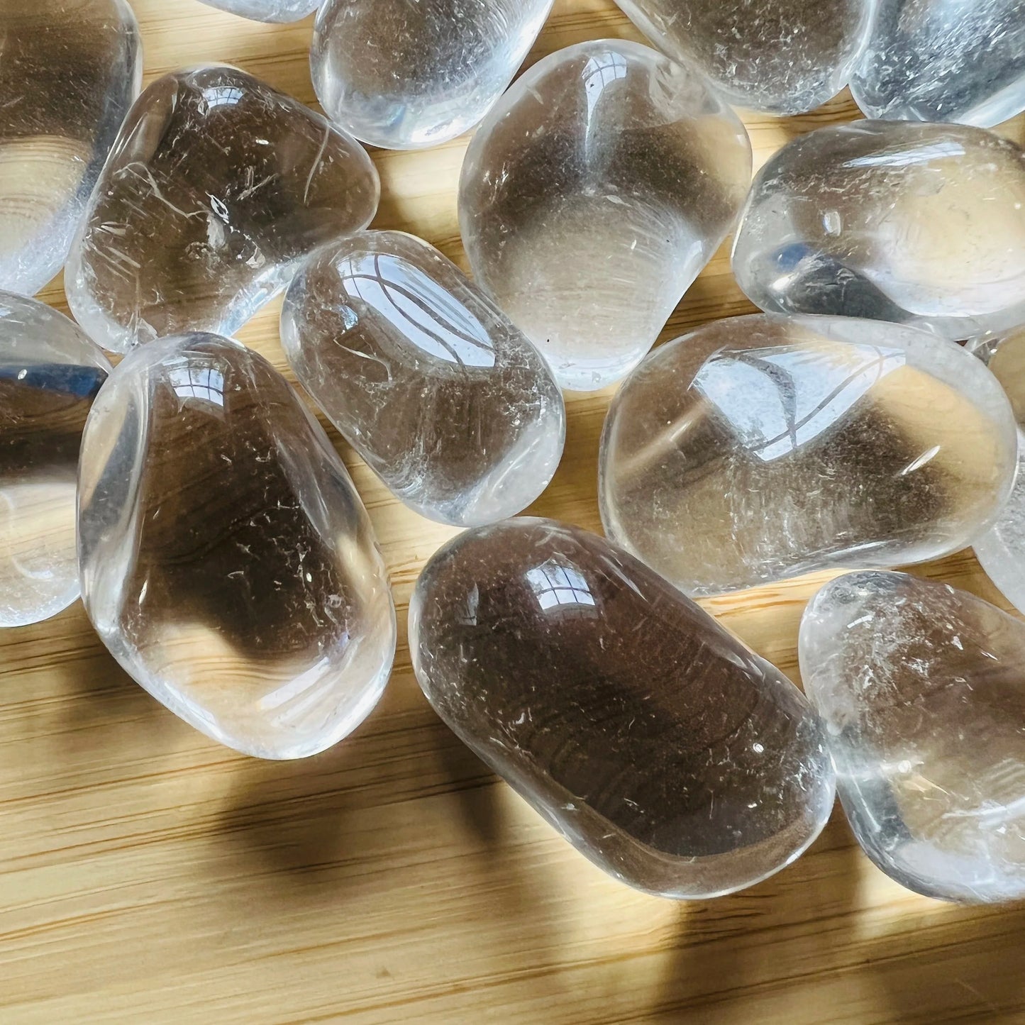 Near view of Grade AAA Clear Quartz tumbled stone, sourced from Minas Gerais, Brazil.