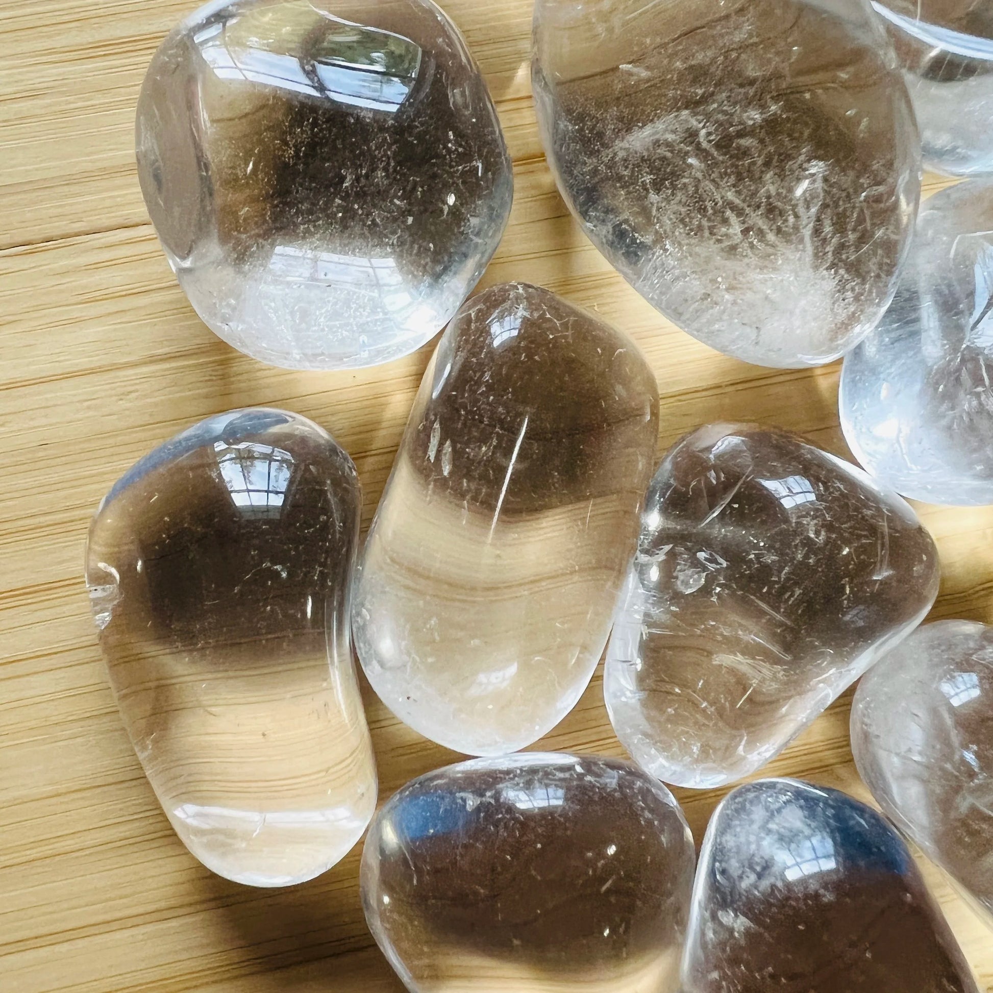 Side angle of Clear Quartz tumbled stone, kept close for Cleansing and Meditation, Brazil-sourced.
