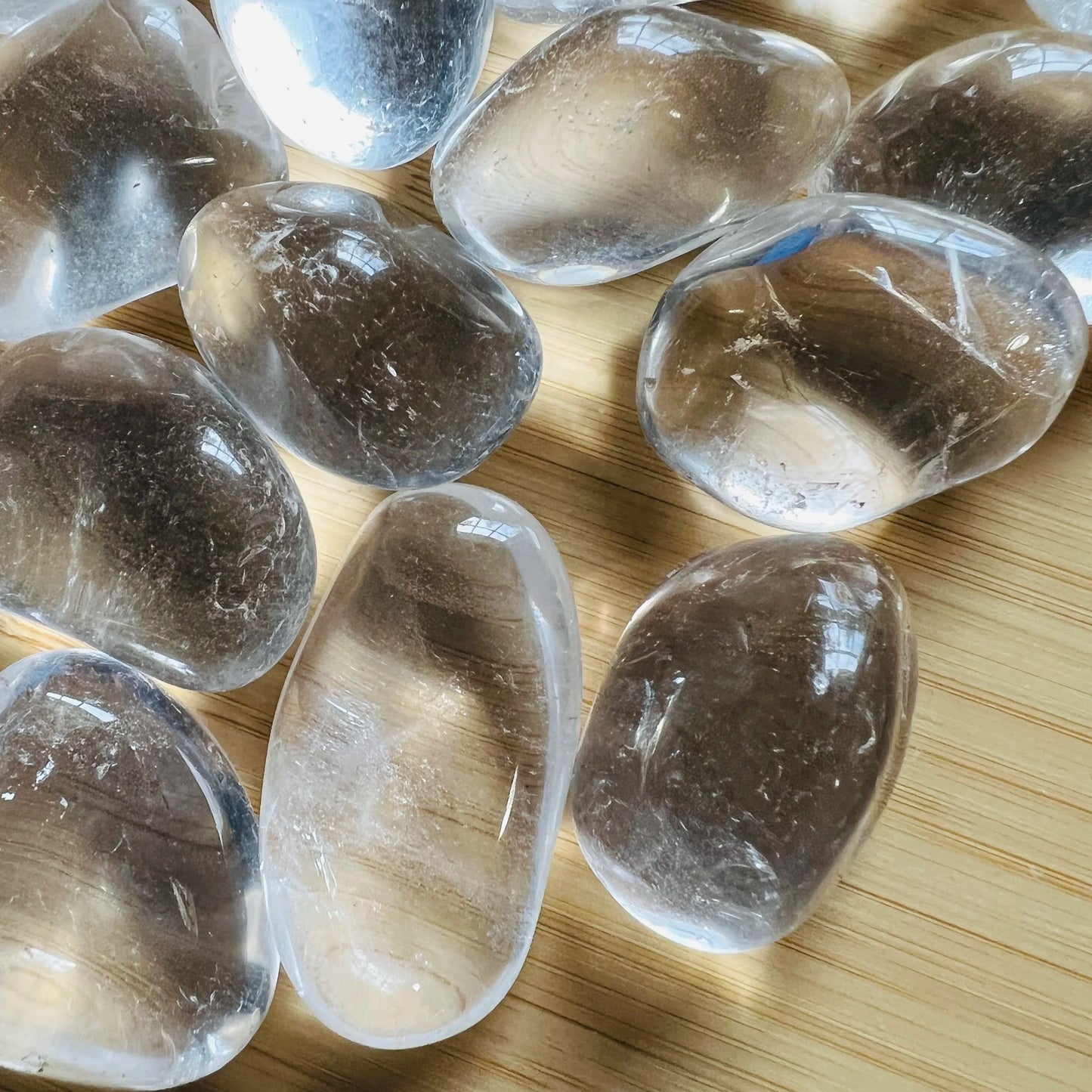 Back view of Clear Quartz tumbled stone, for Cleansing and Meditation.