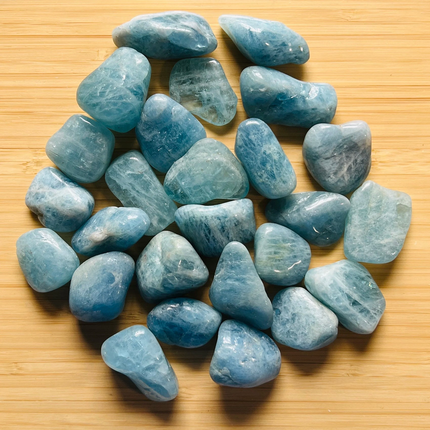 Full profile of Grade AAA Aquamarine tumbled stone ready to ship from Beyond Bohemian