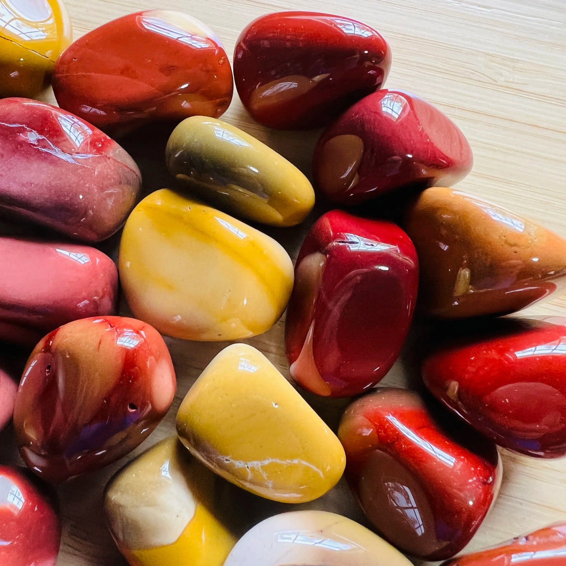 Polished Mookaite pieces showing warm earth-tone banding, from Australia, 0.75 to 1.50 inch