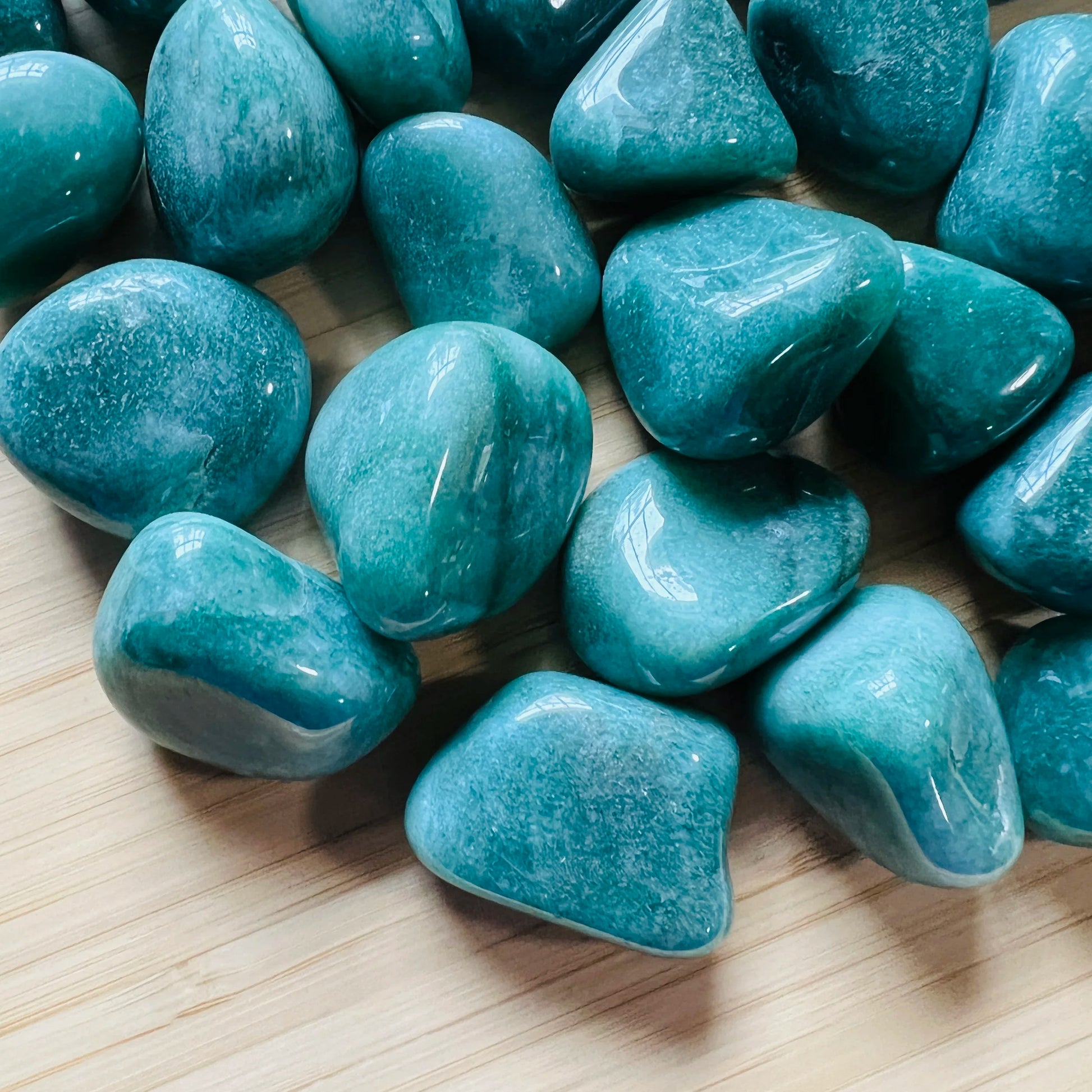 Tight crop of Aventurine tumbled stone, showing characteristic finish, traditionally used for Luck and Abundance.