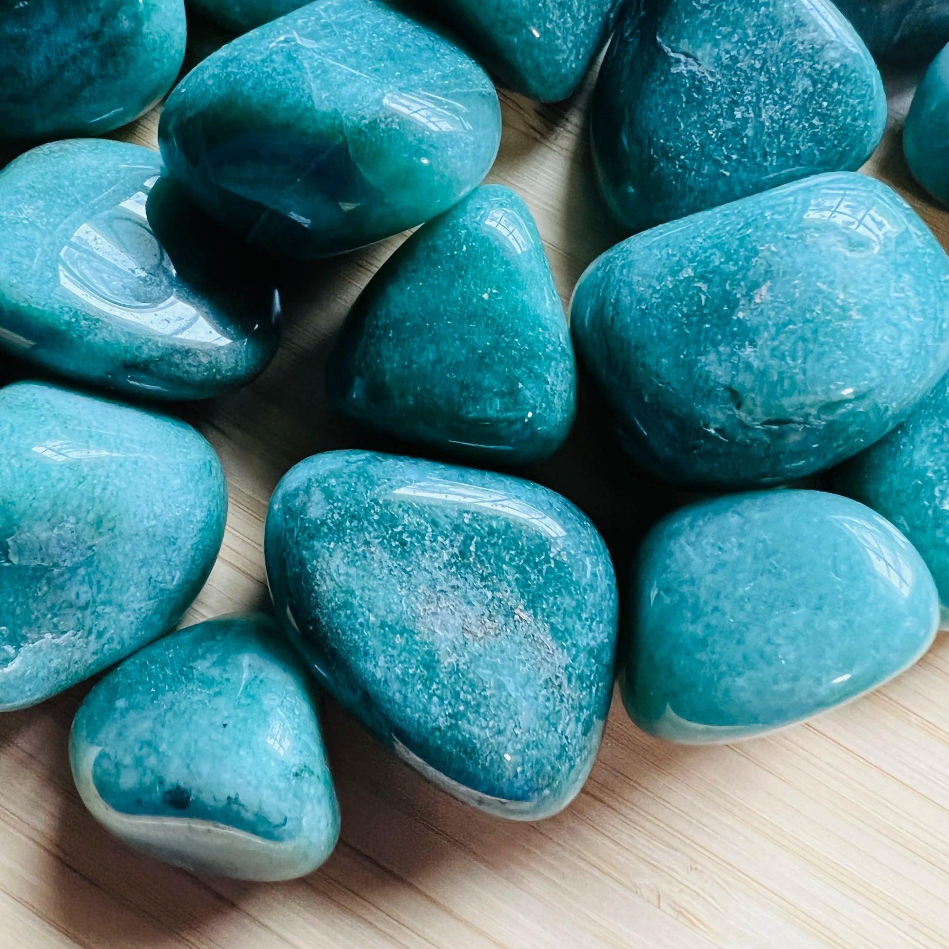Bird's-eye view of Grade AA Aventurine tumbled stone, hand-selected from Minas Gerais, Brazil.