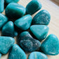 Reverse angle of Aventurine tumbled stone, showing natural inclusions, from Brazil.