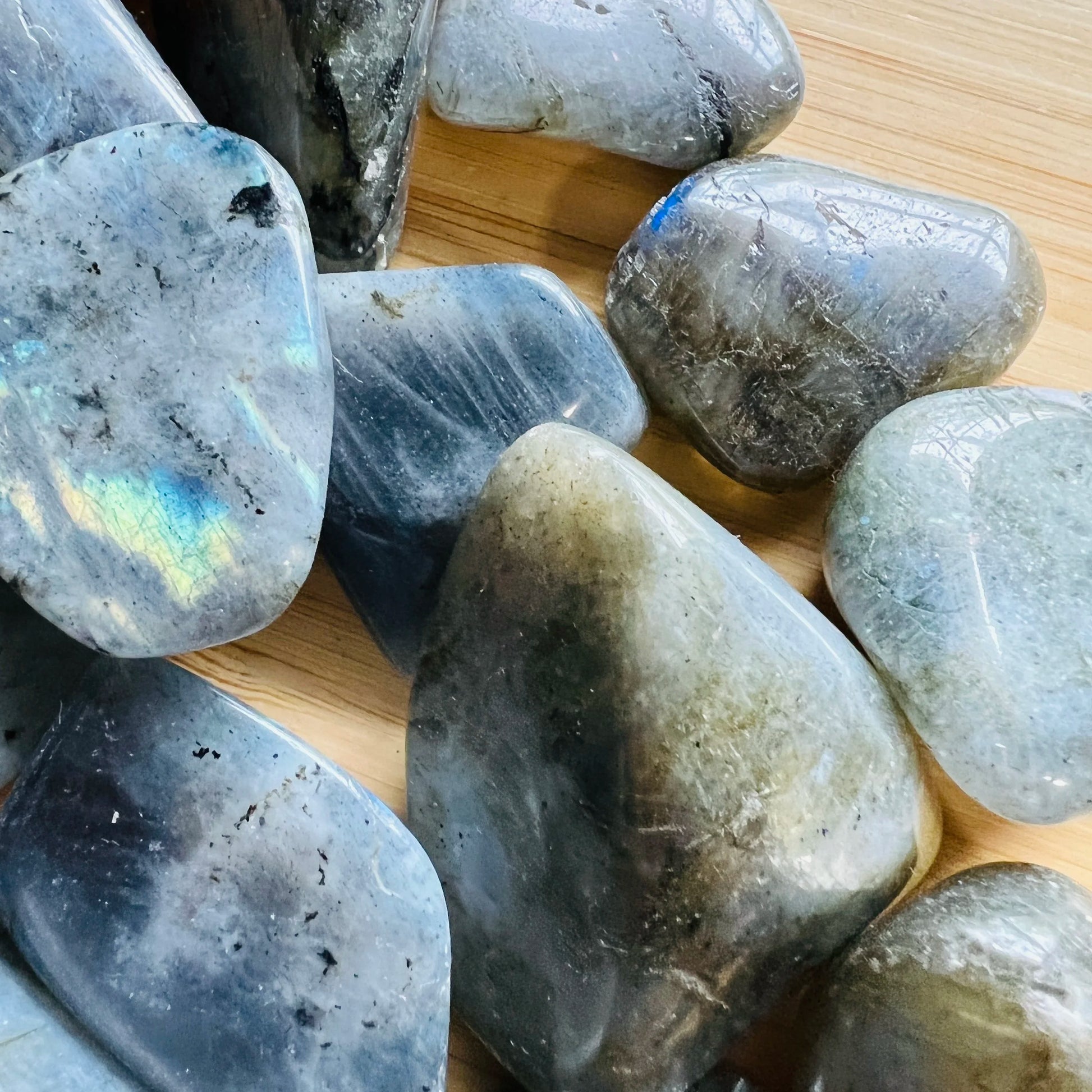 Natural light view of a Labradorite tumbled stone, sourced from Atsimo-Andrefana, Madagascar.