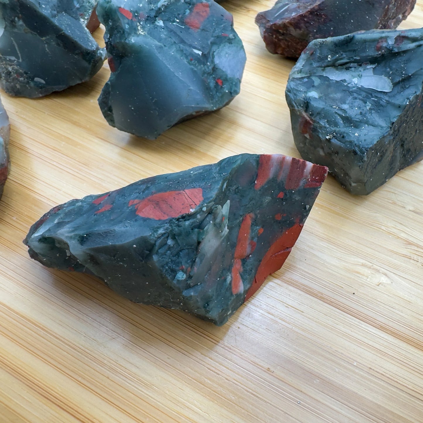 Underside view of green Bloodstone raw stone, worked with for Energy.