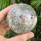 Palm-scale view of a Ocean Jasper polished sphere to support Emotional Healing.