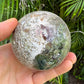 Detail shot of Grade AA Ocean Jasper sphere under natural light