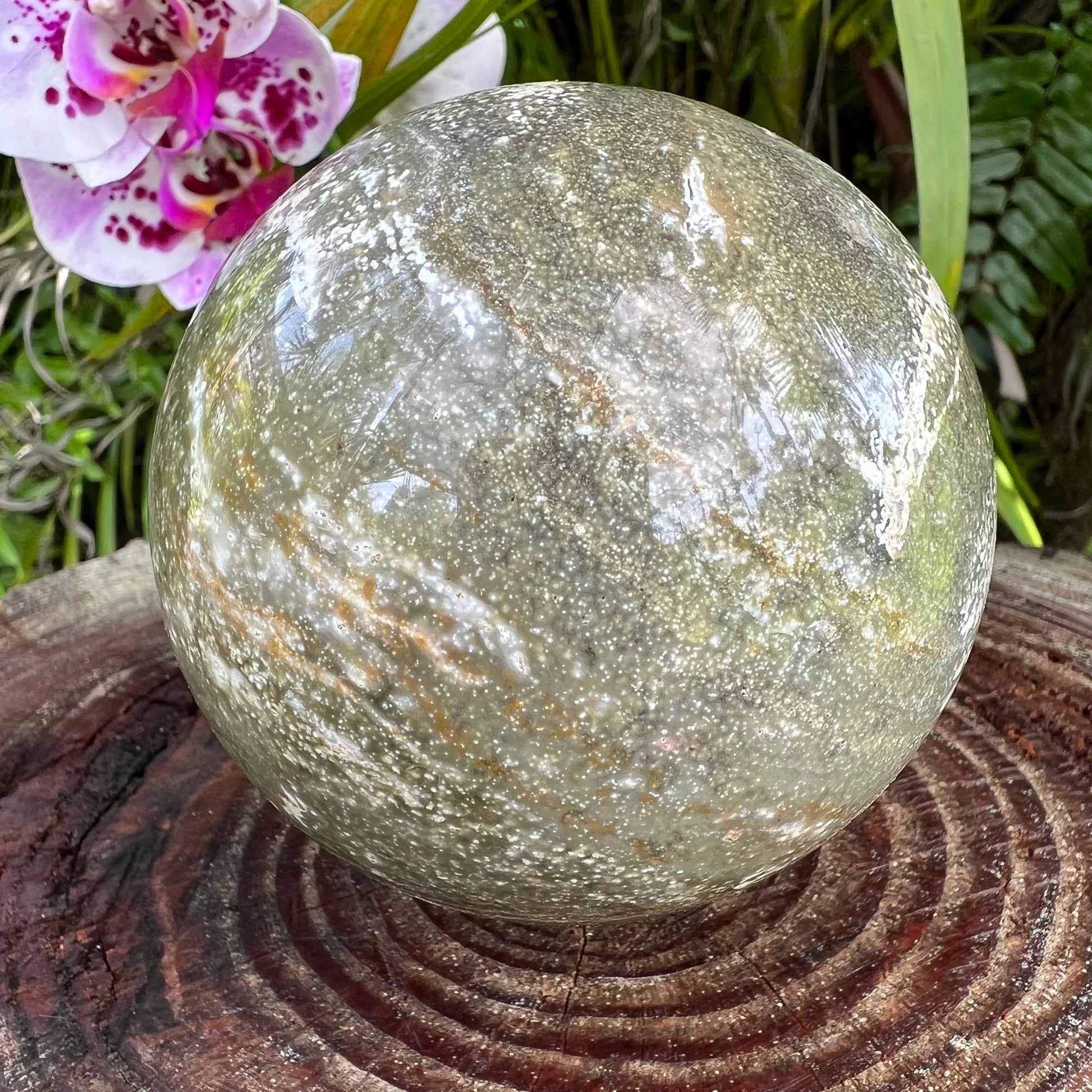 Side angle of Grade AA Ocean Jasper polished sphere, from Sofia, Madagascar.