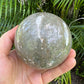 Size comparison with one Ocean Jasper polished sphere for scale, Madagascar-sourced, from Sofia, Madagascar.
