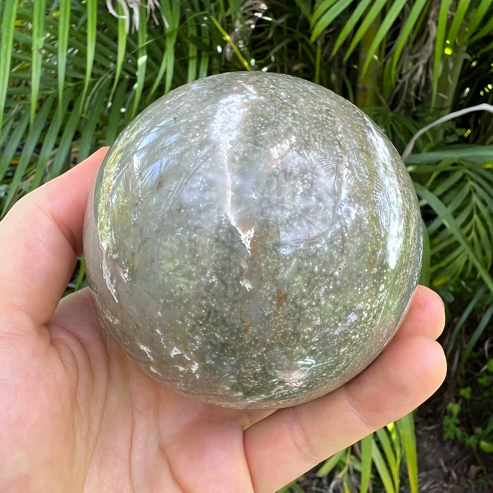 Size comparison with one Ocean Jasper polished sphere for scale, Madagascar-sourced, from Sofia, Madagascar.