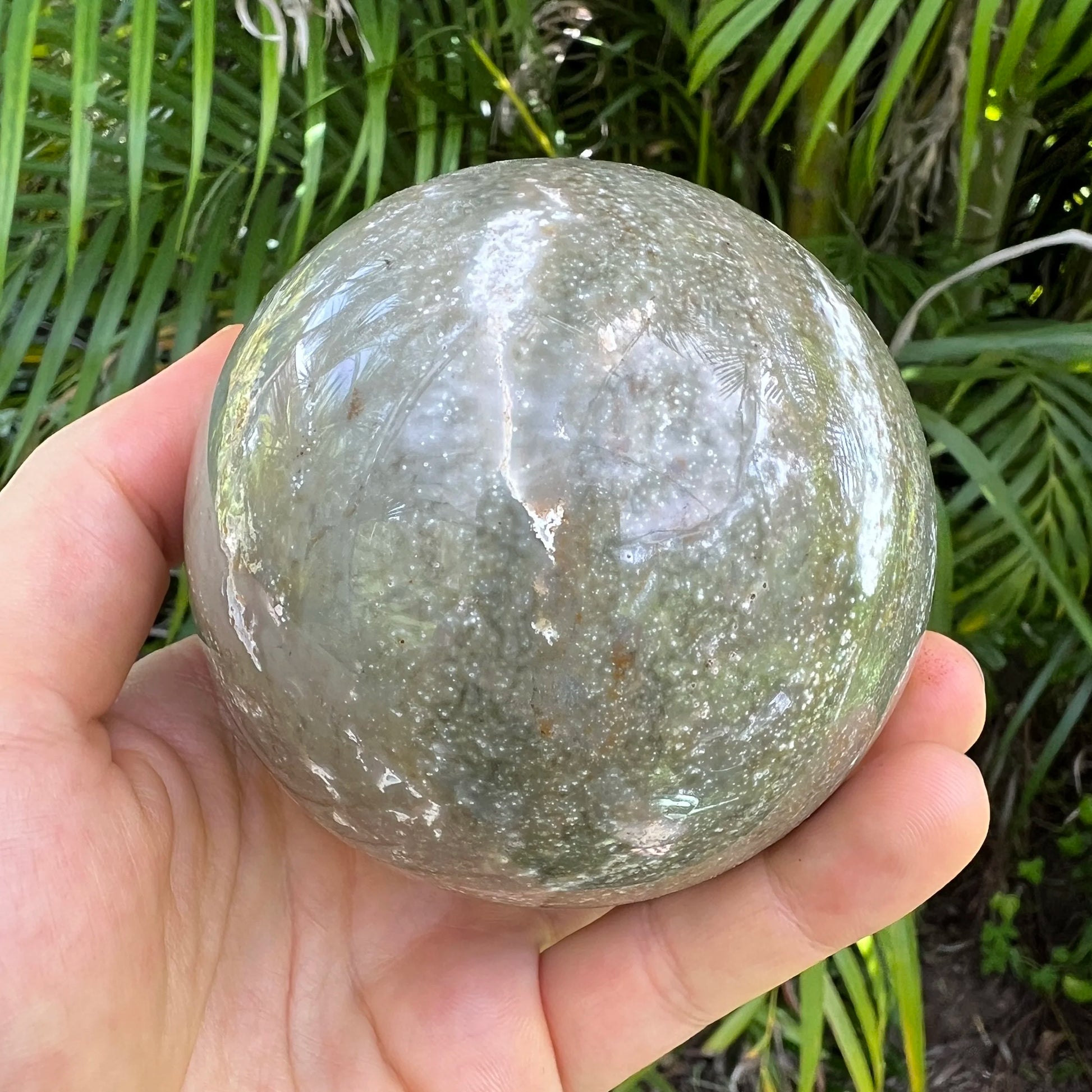 Size comparison with one Ocean Jasper polished sphere for scale, Madagascar-sourced, from Sofia, Madagascar.