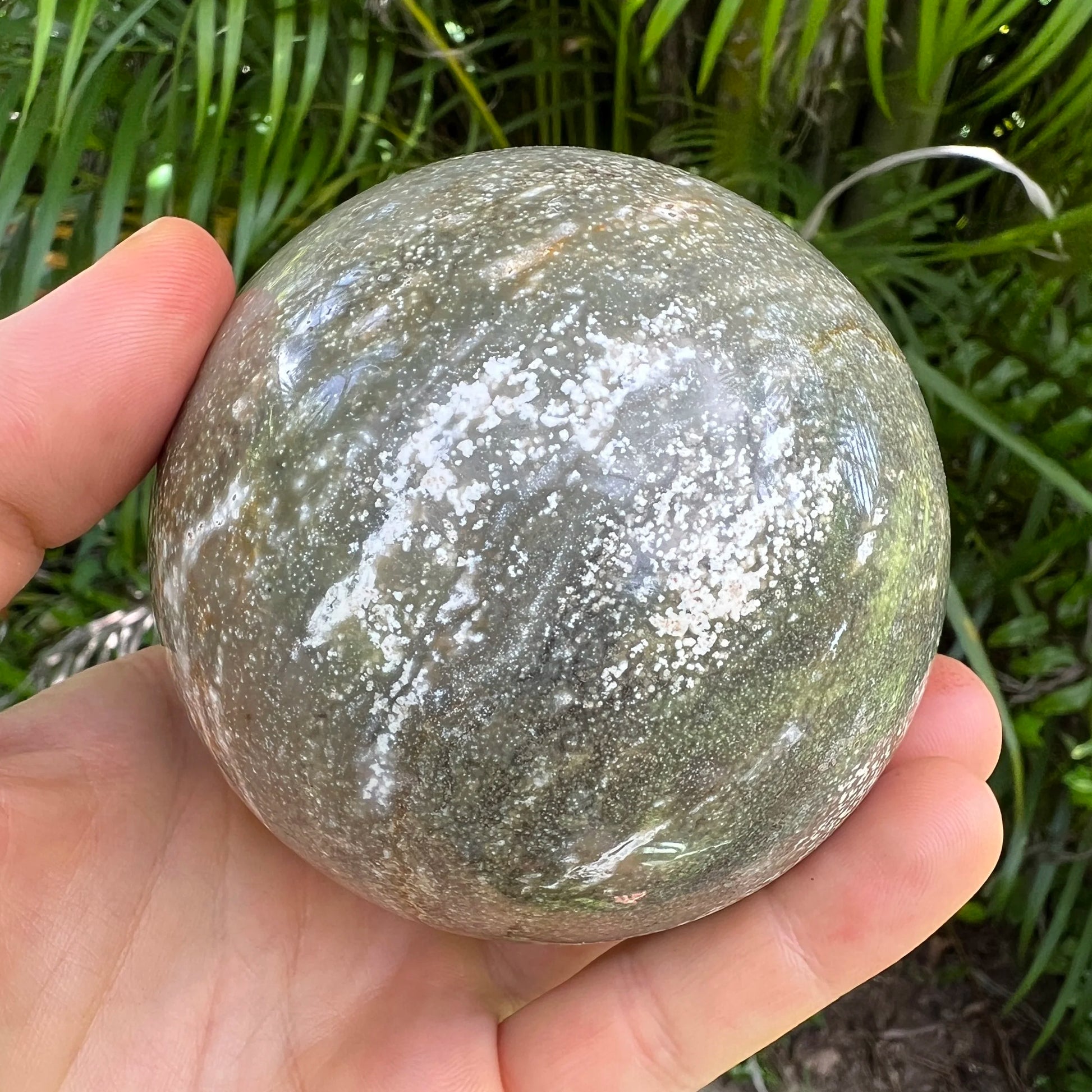 Detail shot of Grade AA Ocean Jasper sphere under natural light