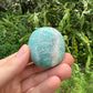 Detail shot of Grade A Amazonite palm stone under natural light