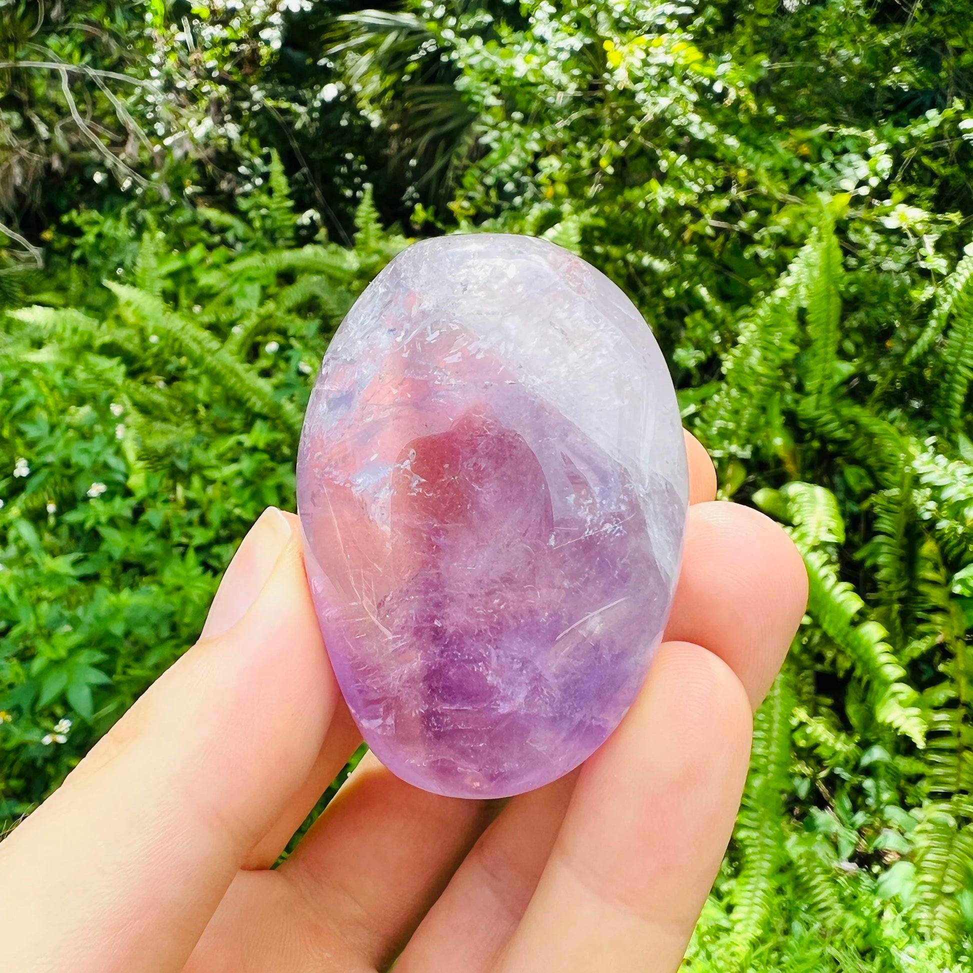 Detail shot of Grade AA Amethyst palm stone under natural light
