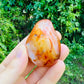 Base detail of Grade AA Carnelian palm stone