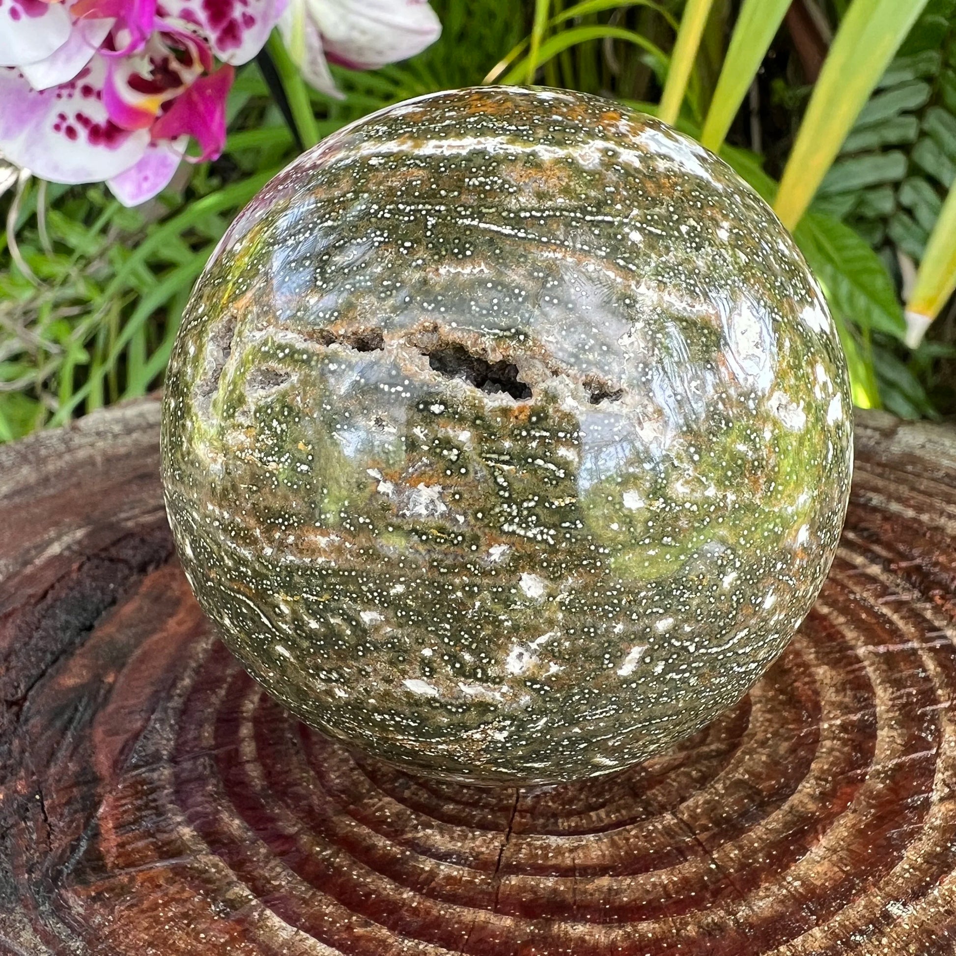 Side-on view of Ocean Jasper polished sphere, from Madagascar, turned to for Emotional Healing.