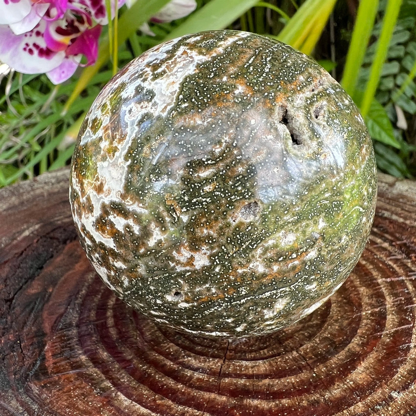 Top-side view of Grade AA Ocean Jasper polished sphere, drawn on for Emotional Healing and Stress Relief, sourced from Sofia.
