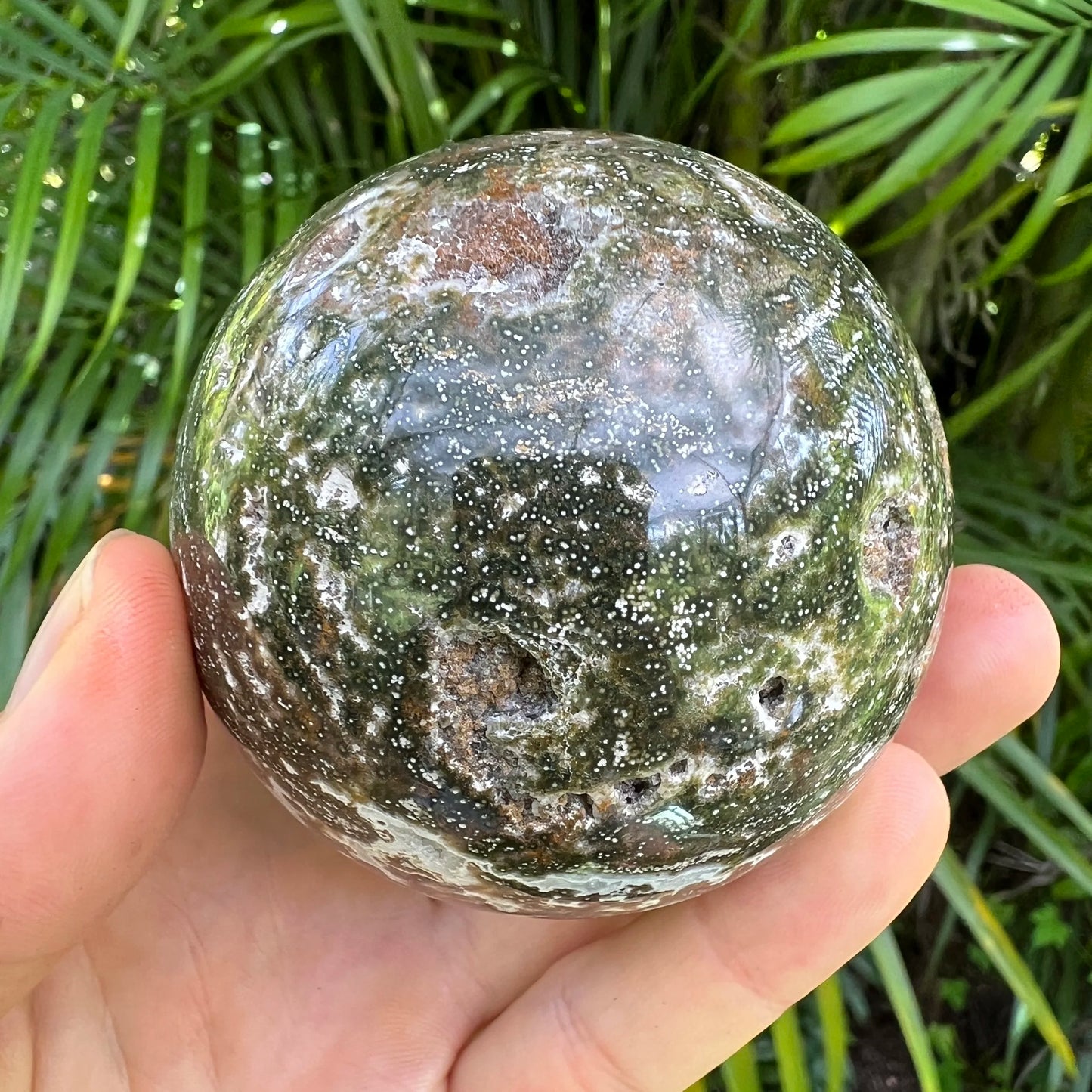 Scale reference of one Ocean Jasper polished sphere for scale, sourced from Sofia, Madagascar.