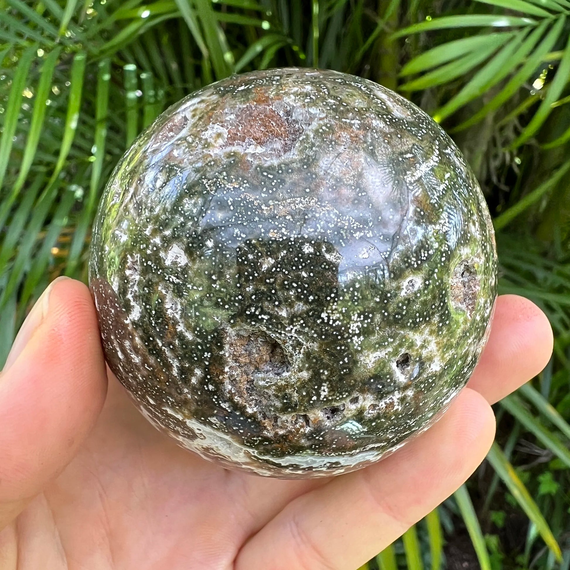 Scale reference of one Ocean Jasper polished sphere for scale, sourced from Sofia, Madagascar.