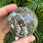 Back view of Grade AA Ocean Jasper sphere showing natural surface