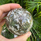 Detail shot of Grade AA Ocean Jasper sphere under natural light