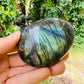 Plan view of Grade AAA Labradorite palm stone, showing matte finish.