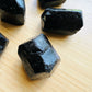 Detail shot of Grade A Black Tourmaline raw under natural light