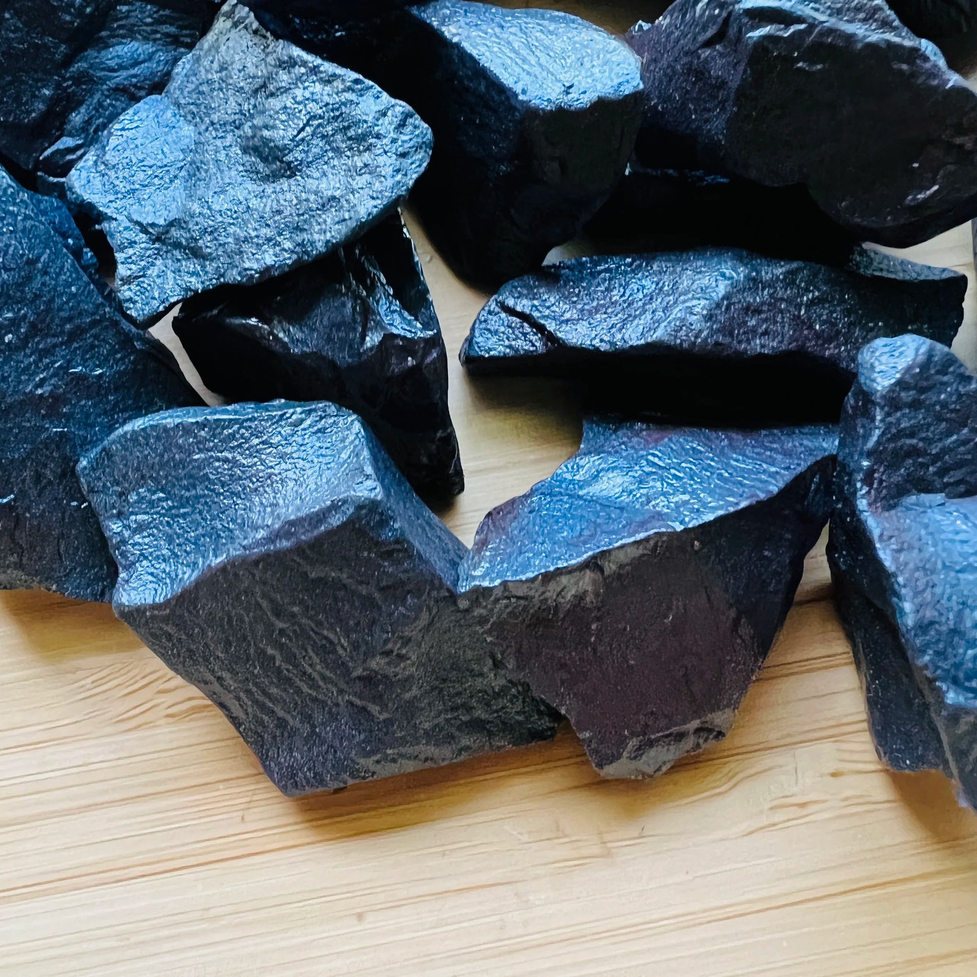Overhead angle of Hematite raw stone, Brazil-sourced, linked to Grounding.