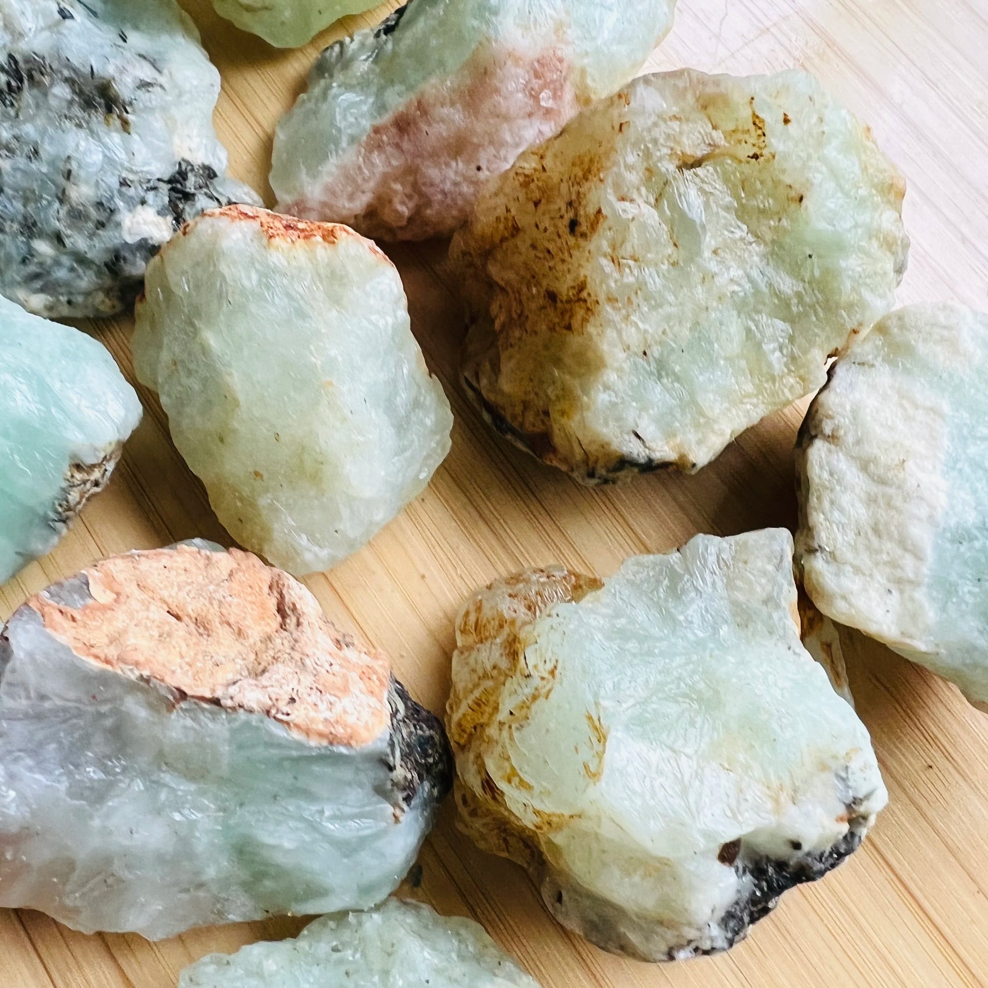 Alternate angle of green Prehnite raw stone, showing characteristic finish, from Kunene, Namibia.